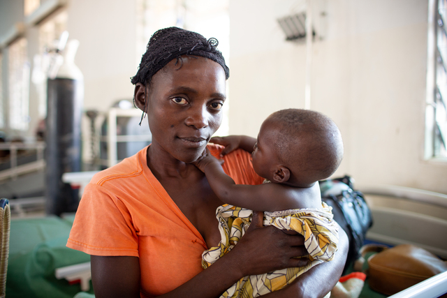 Women holding her child