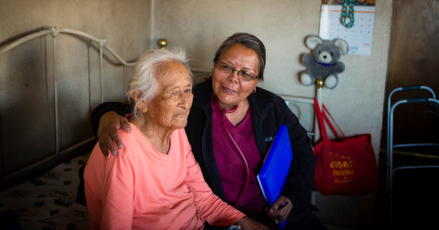 Caretaker in Navajo meeting with patient