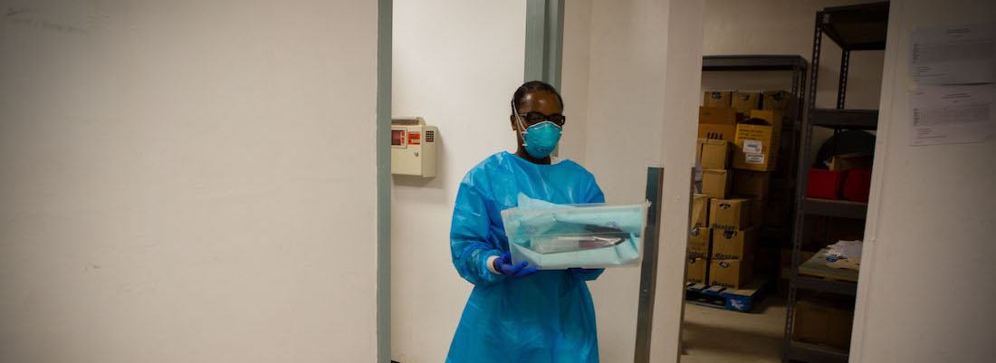 Nurse walking with materials 