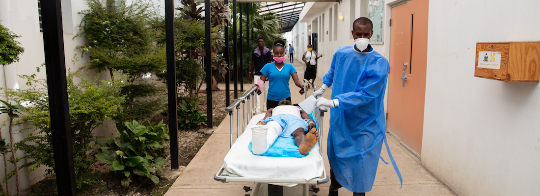 Victims of the August 14 earthquake arrive at Hospital Universitaire de Mirebalais via helicopter air ambulance.