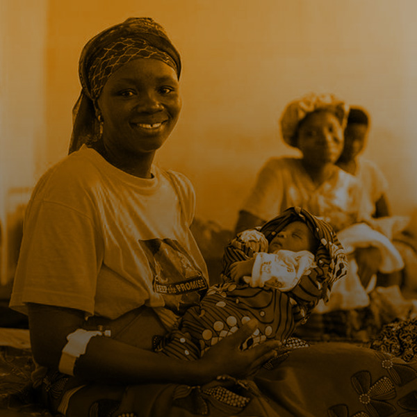 Kumba Sandy holds her newborn baby boy on the day they are being discharged