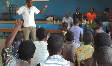 PIH nutrition officer Charles Marshal teaches at Teen HIV Club