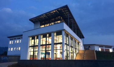 UGHE's administration building lights up twilight on campus in January 2019.