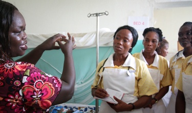 female doctor teaches nurse trainees in southeast Liberia