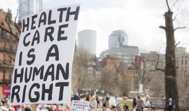 health care is a human right sign at State House rally in Boston
