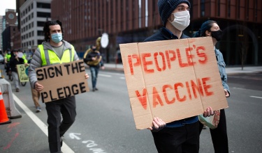 Supporters of a People's Vaccine for COVID-19 march through Cambridge, Massachusetts