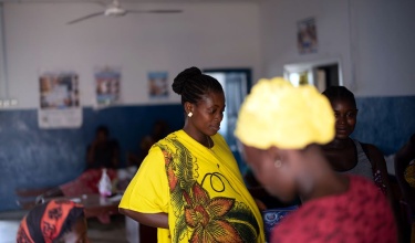 pregnant mother awaits appointment at rural clinic in Sierra Leone