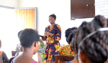 pediatric mental health doctor presents to teen girls in Sierra Leone