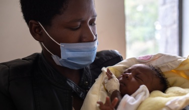 Nyirabizeyimana Fortunée and her daughter, Gwizimpano Nshizirungu Annick, rest in the kangaroo care ward at Butaro District Hospital in May 2021.