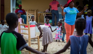 children in circle at haiti