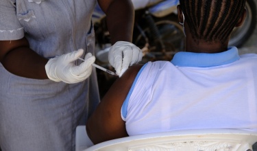 A patient receives a dose of a COVID-19 vaccine in Kono, Sierra Leone.