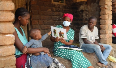 Community health worker Catherine Benito visits a household in Neno District, Malawi.