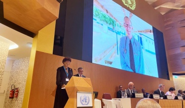 Didi Bertrand receives WHO award on behalf of Dr. Paul Farmer