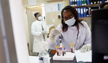 Mary Mebitso works in the lab. The laboratory at PIH-supported Botsabelo MDR-TB Hospital in Maseru, Lesotho.