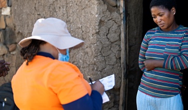 Tuberculosis Screener visits woman at her home in Lesotho