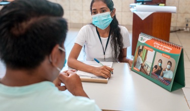 TB peer counsellors Jessica Llerena (right) and Freddy Julca participate in a mock counseling session as part of their training.