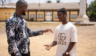 Richard Ellie and David Ellie shake hands outside