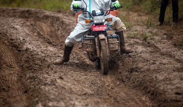 A health worker in Neno District, Malawi, on a motorbike navigates muddy roads to reach patients in hard-to-reach areas.