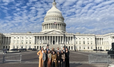 A group of people gathered outside the U.S. Capitol building