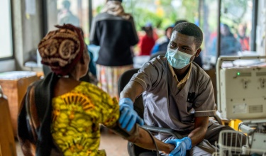 Nurse taking patient's blood pressure at Butaro Level II Teaching Hospital